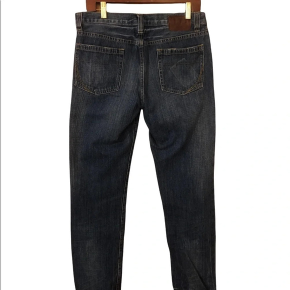 Distressed slim fit tapered jean - Picture 7 of 9